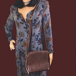 Brown faux leather crossbody bag with woven design